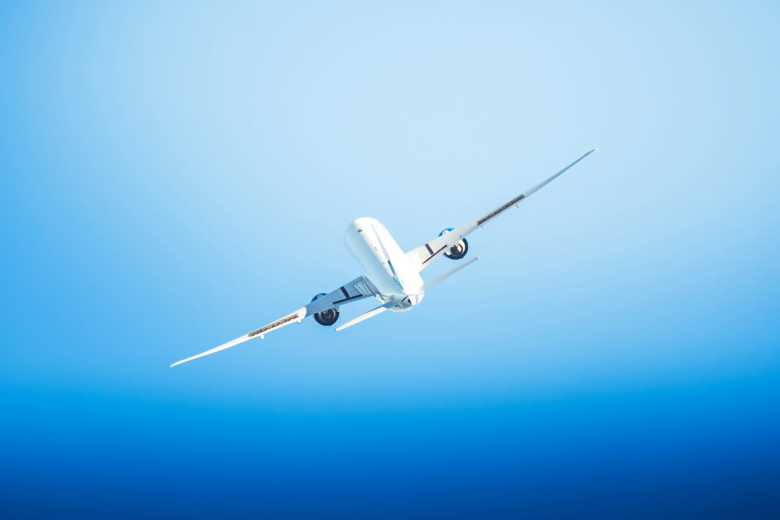 Aircraft banking against a blue sky