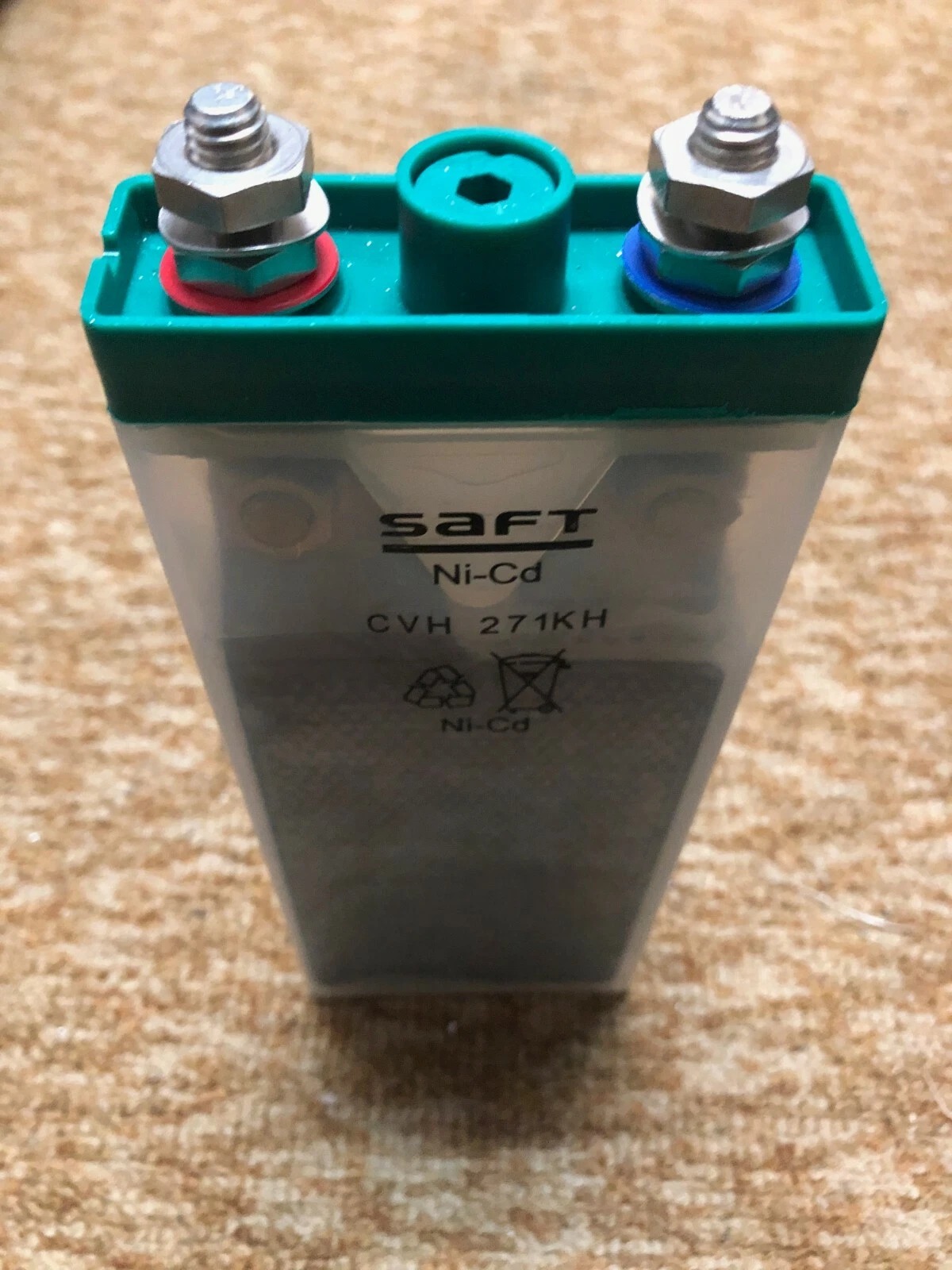 Close-up of an aircraft battery cell during inspection